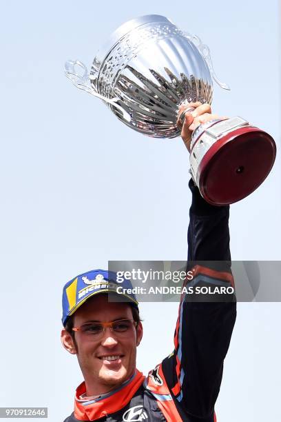 Belgium's driver Thierry Neuville of Hyundai i20 Coupe WRC, hold his trophie as he celebrates on the podium after winning the 2018 FIA World Rally...