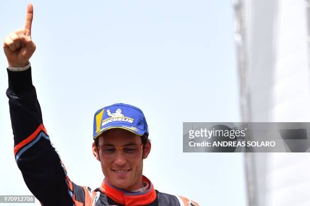 Belgium's driver Thierry Neuville of Hyundai i20 Coupe WRC, gestures as he celebrates on the podium after winning the 2018 FIA World Rally...