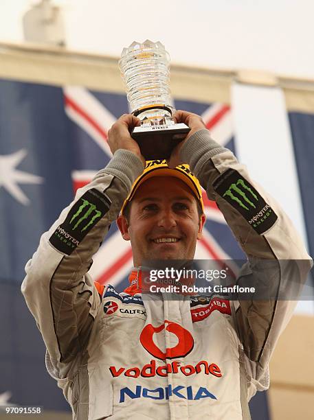 Jamie Whincup driver of the Team Vodafone Holden celebrates after winning race one for round two of the V8 Supercar Championship Series at Bahrain...