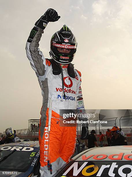 Jamie Whincup driver of the Team Vodafone Holden celebrates after winning race one for round two of the V8 Supercar Championship Series at Bahrain...