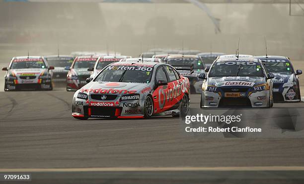 Jamie Whincup drives the Team Vodafone Holden during race one for round two of the V8 Supercar Championship Series at Bahrain International Circuit...