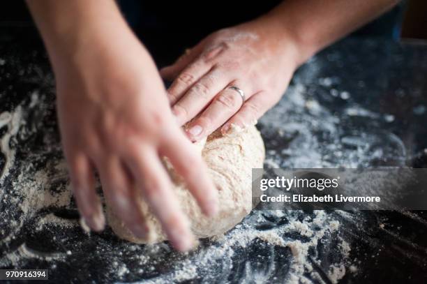 man kneading bread dough - mixing stock pictures, royalty-free photos & images