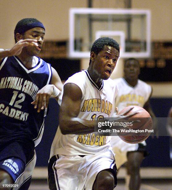 Boys basketball:National Christian at No13 Notre Dame, Middleburg, VA. This is Notre Dame's Todd Galloway on the fast break. On defense for Christian...