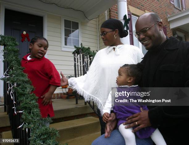 Christopher Smith, President of the Wheeler Creek Resident Association, with his wife Arnita Smith and their two children, Christopher Allen Smith,...