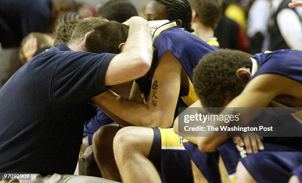 MDBoys13 Date: 3.12.2005 Kevin Clark\The Washington Post Neg #: 165869 College Park, MD Stephen Thompson, head coach of BCC, comforts his players...