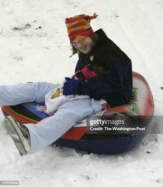 Sm-weather27 01-22-05 Waldorf, Md. Mark Gail/TWP Westlake high school student Julia Steinsberger and Abagail Jane, her potbelly pig enjoy a ride down...