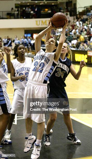 Sp-mdgirls13 03-12-05 Mark Gail_TWP Roosevelt's Kairsten Nunn trys to get the shot off before South River's Kim Milligan blocks it in the Class 4A...