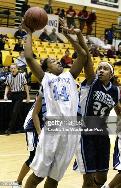 Sp-mdgirls11 03-10-05 Mark Gail_TWP Eleanor Roosevelt's Keisha Wright goes to the basket pass Springbrook's Joia Daniels in class 4A semi-finals at...