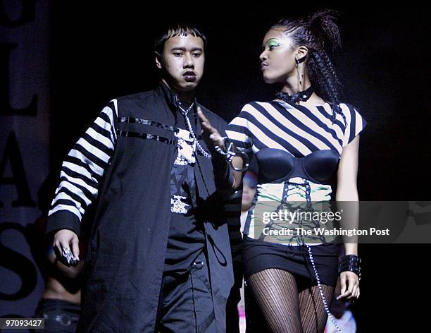 Pg-fashion20 01-15-05 College Park, Md Mark Gail/TWP C. H. Flowers high school 's Atiya Johnson leads Bogartha Soeprapto around the stage, one of the...