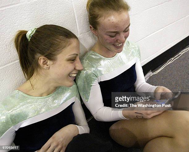Pg-gymnast10 03-05-05 Mark Gail_TWP Amanda Sexton watchs Kristen Clarke send her boyfriend a text message about her scores at the 28th annual Capitol...