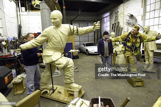 Aa-cover27 1-6-05 Baltimore, Md Mark Gail/TWP Anne Arundel County volunteer firefighter Dan Ringwelski poses for sculptor Rodney Carroll as he works...