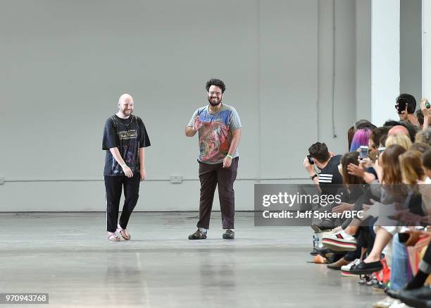 Designers James Theseus Buck and Luke Brooks walk the runway at the Rottingdean Bazaar show as part of the MAN show during London Fashion Week Men's...