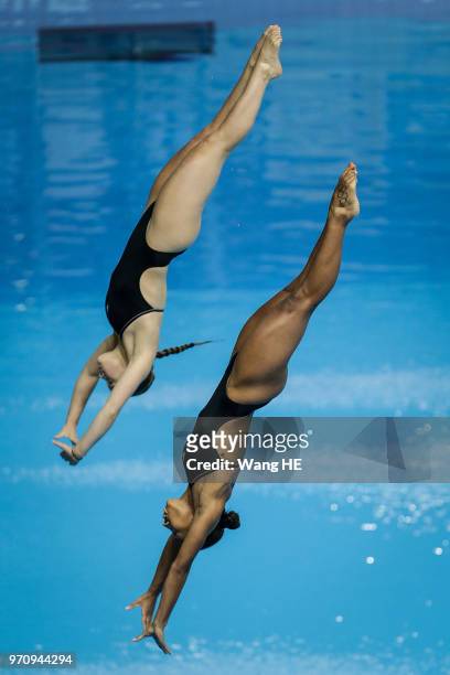 Jennifer Abel and Melissa Citrini Benulieu of Canada compete in the women's 3m Synchro Springboard final on FINA Diving World Cup 2018 at the Wuhan...