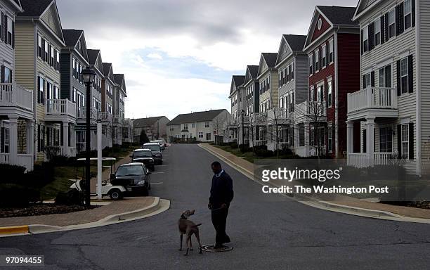 Dudley M. Brooks/TWP Christopher Williams with his dog Duchess, a weineraner, resides in the pet friendly apartment and rental townhouse community of...