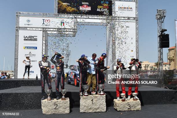 First placed French driver Sebastien Ogier and co-driver Julien Ingrassia of Ford Fiesta WRC, second placed Belgium's driver Thierry Neuville and...