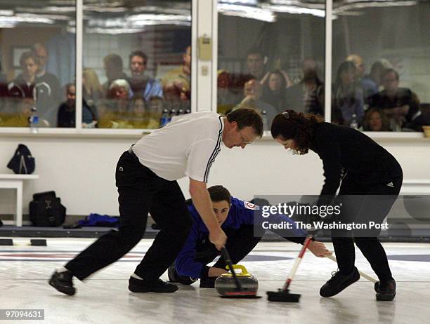 Jahi chikwendiu Darren Lehto , Bev Walter , and Brady Clark , of the Washington team, participate in the finals of the US Mixed National Curling...