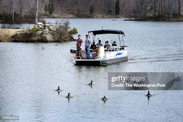 April 1, 2006 Slug: pw-cleanup sassignment Lake Ridge Marina Lake Ridge, VA Photographer: Gerald Martineau river cleanup Bud Craft pilots his pontoon...