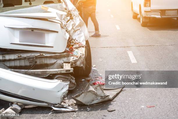 auto accident involving two cars on a city street - car crash scene stock-fotos und bilder