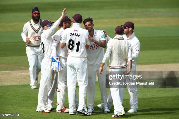 Jade Dernbach of Surrey celebrates with his teammates after dismissing Joe Weatherley of Hampshire during the Specsavers County Championship Division...