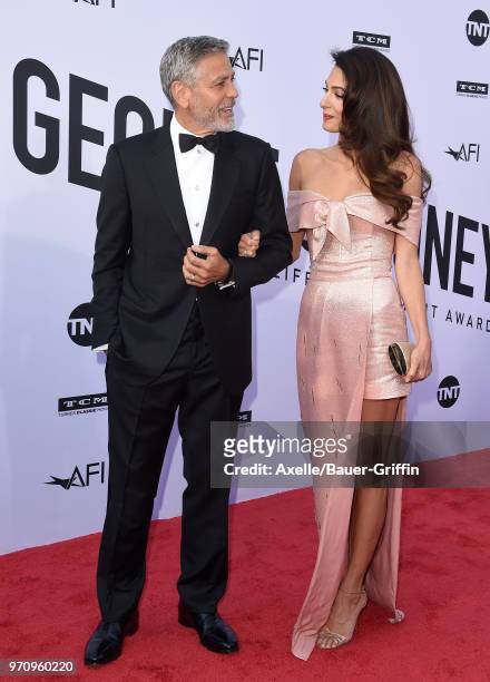 Actor George Clooney and Amal Clooney arrive at the American Film Institute's 46th Life Achievement Award Gala Tribute to George Clooney on June 7,...