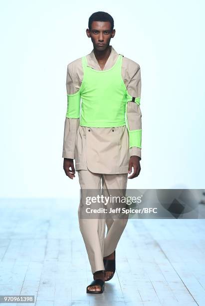 Model walks the runway at the Alex Mullins show during London Fashion Week Men's June 2018 at the BFC Show Space on June 10, 2018 in London, England.