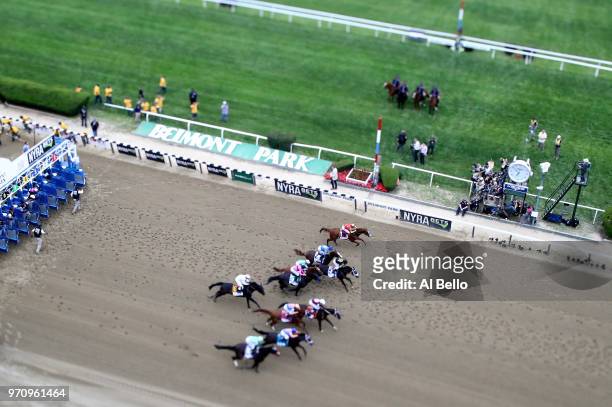 Justify, ridden by jockey Mike Smith start with the other horses on his way to winning the 150th running of the Belmont Stakes at Belmont Park on...