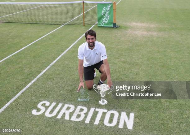 Jeremy Chardy of France poses for the camera with the Surbiton Trophy after his victory over Ale De Minaur of Australia during their Mens Final match...