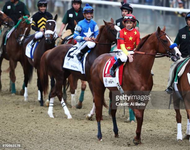 Jockey Mike Smith sits atop of Justify before the 150th running of the Belmont Stakes at Belmont Park on June 9, 2018 in Elmont, New York. Justify...