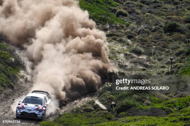 Estonian driver Ott Tanak steers his Toyota Yaris WRC with his co-driver Martin Jarveoja, during the 2018 FIA World Rally Championship on June 10,...
