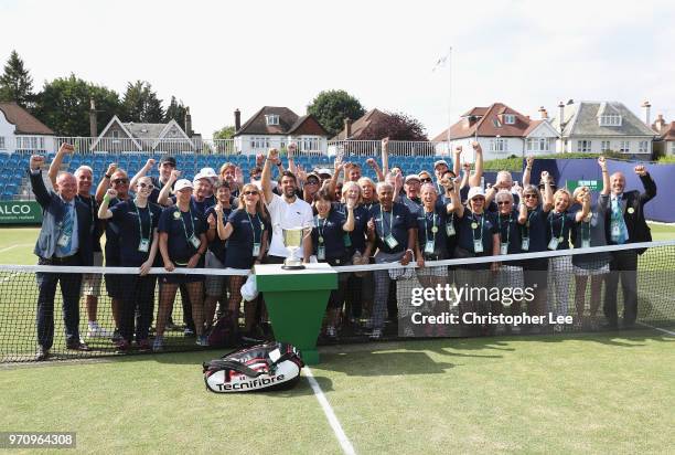 Jeremy Chardy of France celebrates with the Surbiton Trophy and with volunteers after his victory over Alex De Minaur of Australia during their Mens...