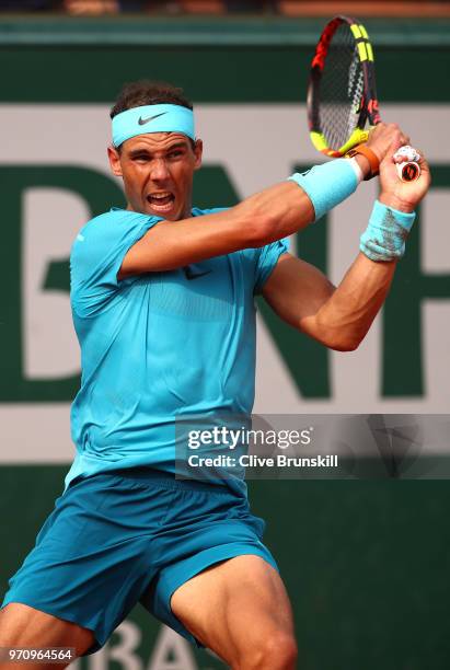 Rafael Nadal of Spain plays a backhand during the mens singles final against Dominic Thiem of Austria during day fifteen of the 2018 French Open at...