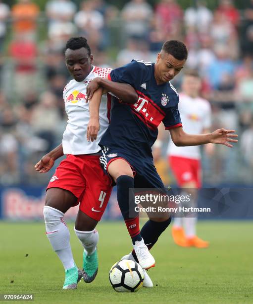 Oliver Batista Meier of FC Bayern Muenchen U17 and Kossivi Amededjisso of RB Leipzig U17 compete during the B Juniors German Championship Semi Final...