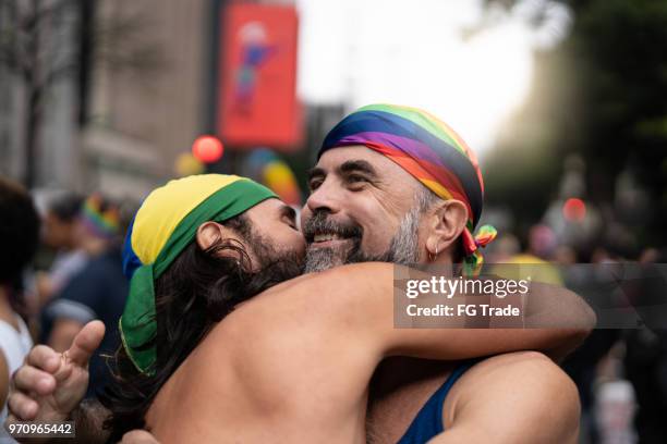 couple on affection moment at street - lgbt men kissing stock pictures, royalty-free photos & images