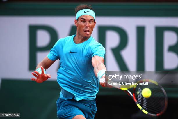 Rafael Nadal of Spain plays a forehand during the mens singles final against Dominic Thiem of Austria during day fifteen of the 2018 French Open at...