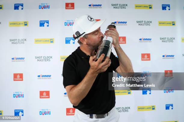 Mikko Korhonen of Finland kisses the trophy after winning The 2018 Shot Clock Masters during day four of The 2018 Shot Clock Masters at Diamond...
