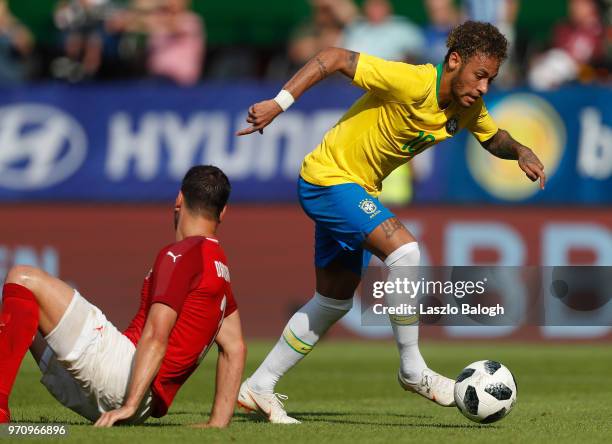 Neymar of Brazil fights for the ball with Alleksandar Dragovic of Austria during an International Friendly match at Ernst Happel Stadium on June 10,...