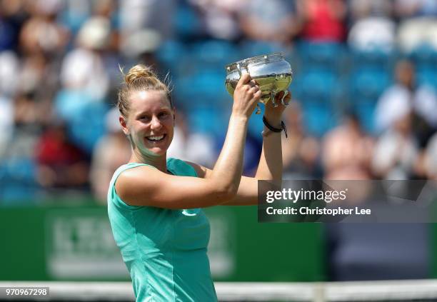 Alison Riske of USA poses for the camera with the Surbition Trophy after her victory over Conny Perrin of Switzerland during their Womens Final match...