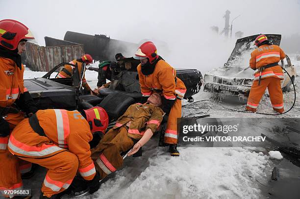 Belarussian Emergency Situations Ministry rescue a crash dummy from a car accident 80 km north of Minsk near the village Svetlaya Roshcha on February...