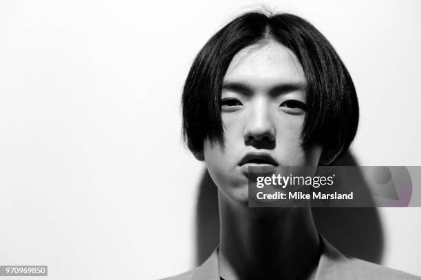 Model backstage ahead of the Christopher Raeburn show during London Fashion Week Men's June 2018 at the BFC Show Space on June 10, 2018 in London,...