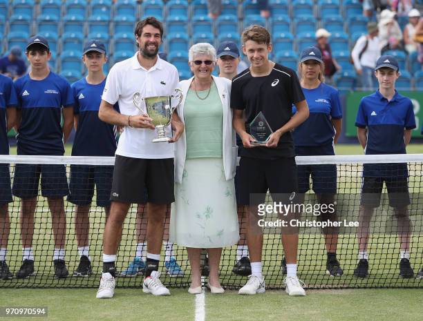Winner, Jeremy Chardy of France with the Surbiton Trophy, Judy Tegart-Dalton and Runner Up, Alex De Minaur of Australia pose for the camera during...