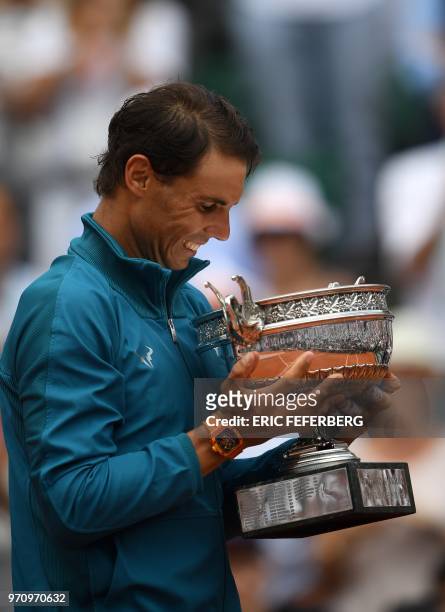 Spain's Rafael Nadal holds La Coupe des Mousquetaires - The Musketeers' Trophy after defeating Austria's Dominic Thiem in their men's singles final...