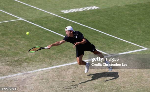 Alex De Minaur of Australia in action against Jeremy Chardy of France during their Mens Final match on Day 09 of the Fuzion 100 Surbition Trophy on...