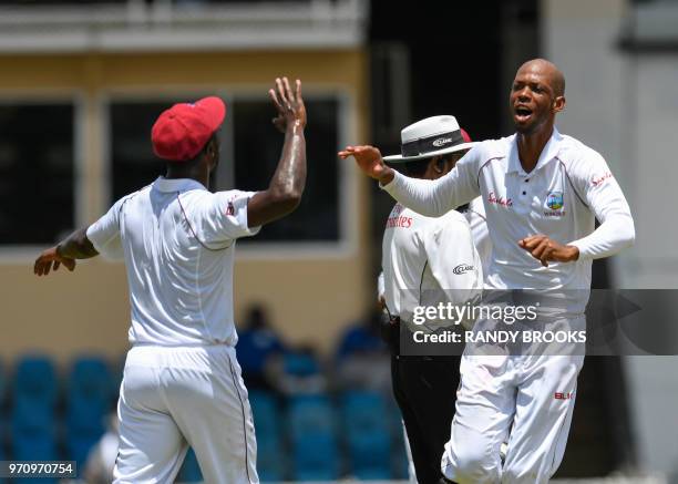 Roston Chase celebrates the dismissal of Niroshan Dickwella of Sri Lanka during day 5 of the 1st Test between West Indies and Sri Lanka at Queen's...