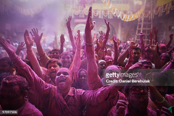 Hindu devotees play with colour during Holi celebrations at the Bankey Bihari Temple on February 26, 2010 in Vrindavan, India. The tradition of...