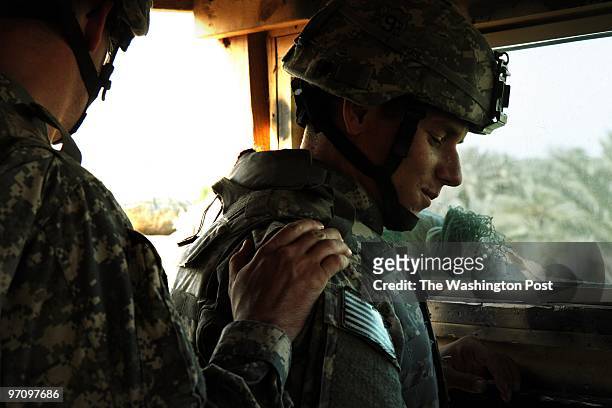 Spc. Matthew Clark of Victoria, TX, gets encouragement from the Brigade chaplain while he stands guard at Camp Trotter, a station of Camp Corregidor...