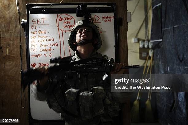 Private Chris Eckert of Albany, NY, is reprimanded for falling asleep while standing guard by holding his rifle in front of him for an extended...