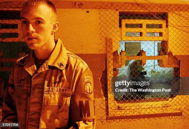 Military Police Sgt. Sean Boney of Shelbyville, MI, works in the Abu Ghraib prison intake. The intake building was heavily damaged, burned when...