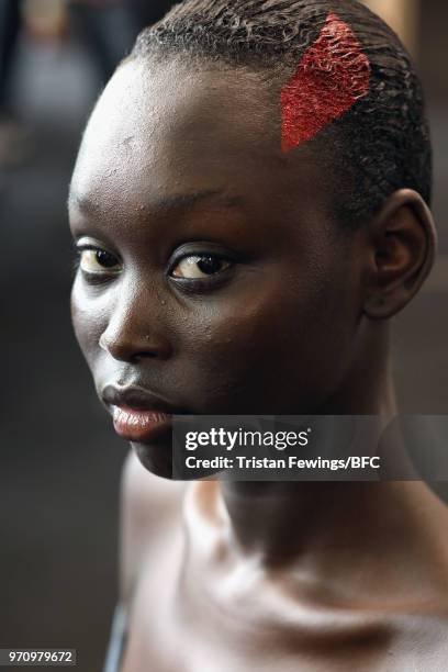 Model backstage ahead of the Christopher Raeburn show during London Fashion Week Men's June 2018 at the BFC Show Space on June 10, 2018 in London,...