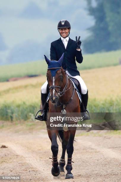 Jens Hilbert rides on Guess during the Balve Optimum International Horse Show on June 8, 2018 in Balve, Germany.