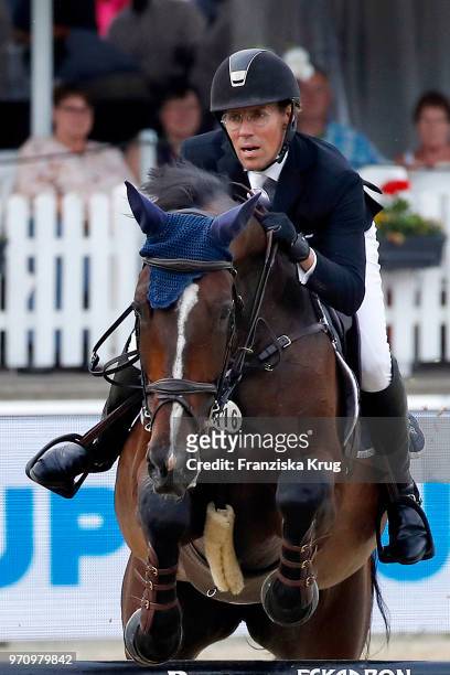 Jens Hilbert rides on Guess during the Balve Optimum International Horse Show on June 8, 2018 in Balve, Germany.